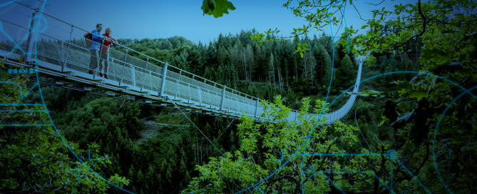 Hiker on Geierlay Suspension Bridge